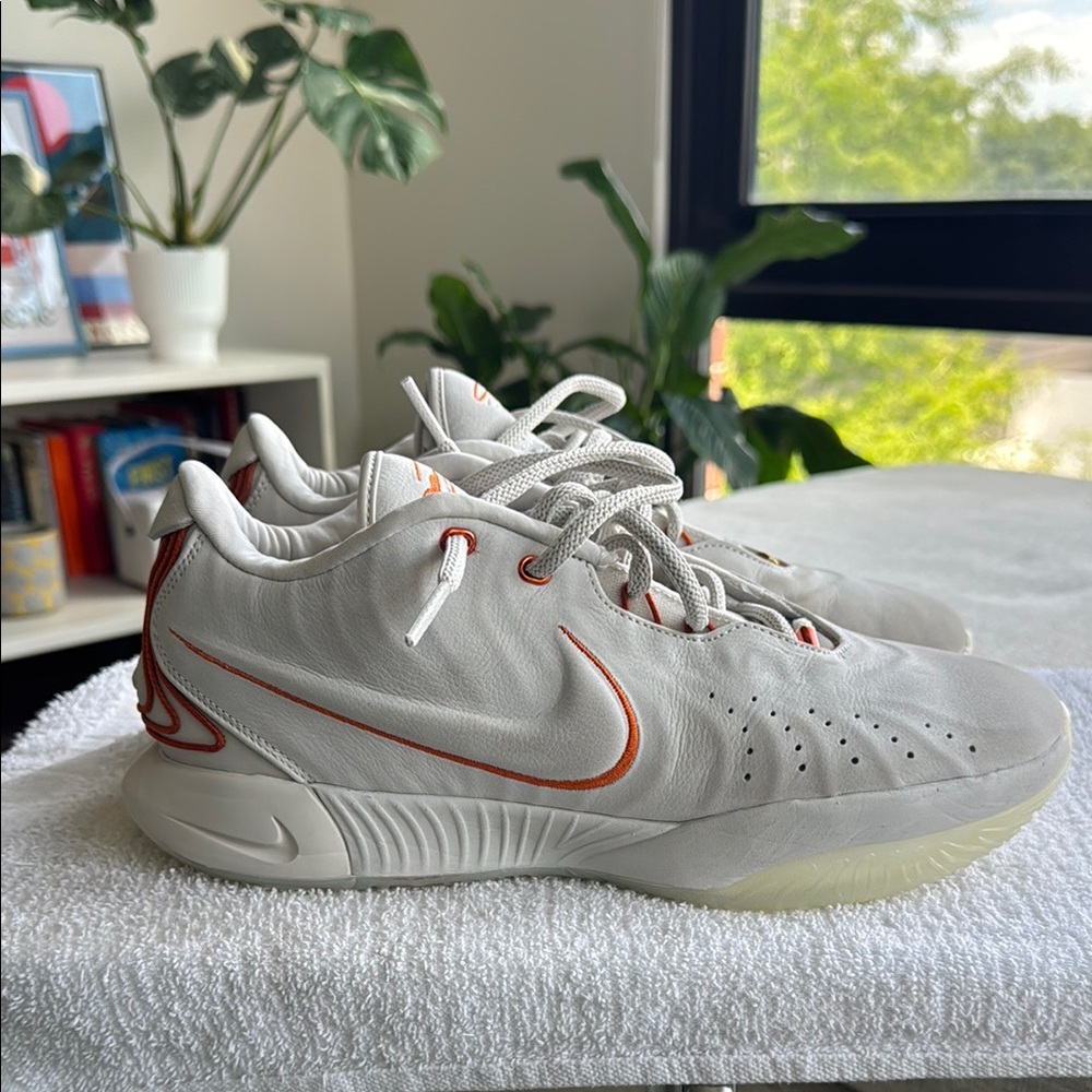 LeBron 21 "Akoya" Off-white leather upper with striated textures.